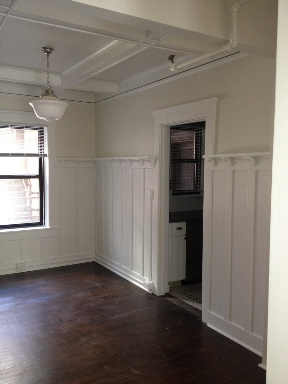 Renovated unit with refinished floors at Adams Apartments